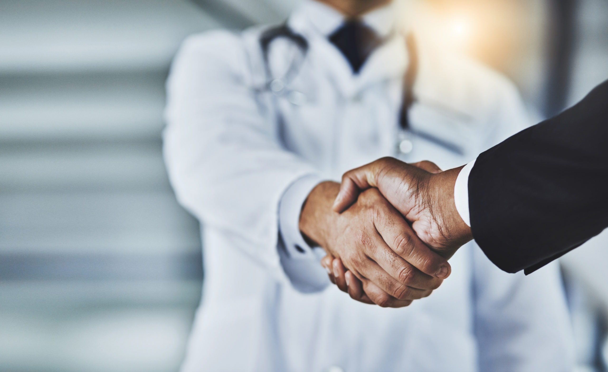 case study doctor shaking hands